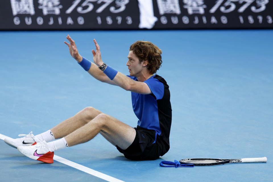 Andrey Rublev of Russia reacts after defeating Holger Rune of Denmark in their fourth round match at the Australian Open tennis championship in Melbourne, Australia, Monday, Jan. 23, 2023. (AP Photo/Asanka Brendon Ratnayake)