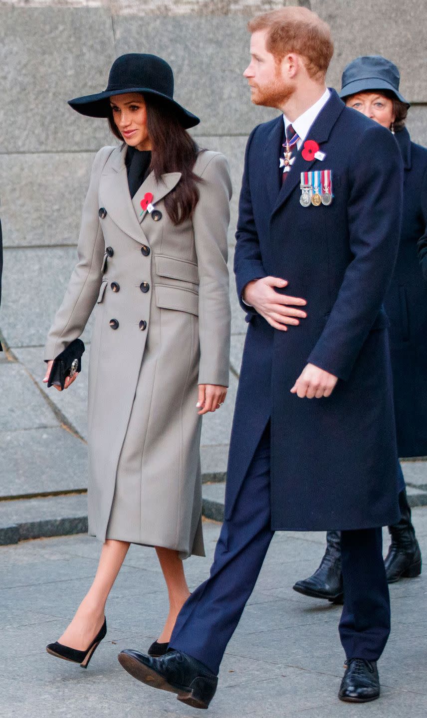 <p>For her first Anzac Day service, Meghan opted for a <a href="https://www.cosmopolitan.com/uk/fashion/celebrity/a20058836/meghan-markle-anzac-day-service-black-hat/" rel="nofollow noopener" target="_blank" data-ylk="slk:muted outfit;elm:context_link;itc:0;sec:content-canvas" class="link ">muted outfit</a>accessorising her grey coat with a black wide brimmed hat and mini black Gucci bag. </p>