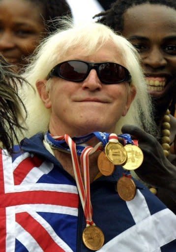 File picture from 2002 of Jimmy Savile. An inquiry into the BBC's culture and practices begins a year to the day since the death of Savile, the eccentric presenter now considered one of the most prolific sex offenders in British history, with some 300 alleged victims coming forward in recent weeks