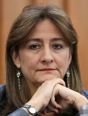 FILE PHOTO: A member of the Inter-American Human Rights Commission (CIDH) Angela Buitrago listens to a journalist's questions during a news conference about the case of the missing students of Ayotzinapa, in Mexico City, Mexico December 7, 2015. REUTERS/Ginnette Riquelme/File Photo