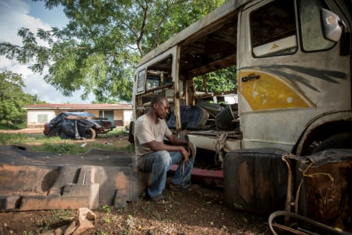 Ernest Yaw Owusu, 38, sits in his car workshop in Ghana and says if he had the money he would go to Libya and then try to get to Europe