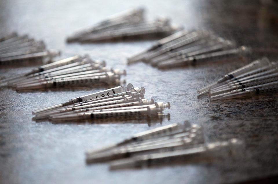 Syringes that will be used with the Pfizer COVID-19 vaccine are at the ready at Corinthian Baptist Church in Cincinnati's Bond Hill neighborhood Feb. 24.