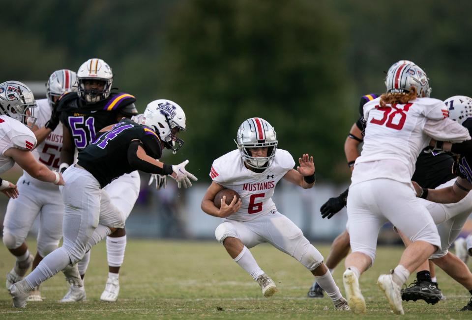 Westfall's Joey Wright (#6) runs the ball during the Mustangs game against the Unioto Shermans in high school football action at Unioto High School on September 8, 2023, in Chillicothe, Ohio. Unioto defeated Westfall 48-26.