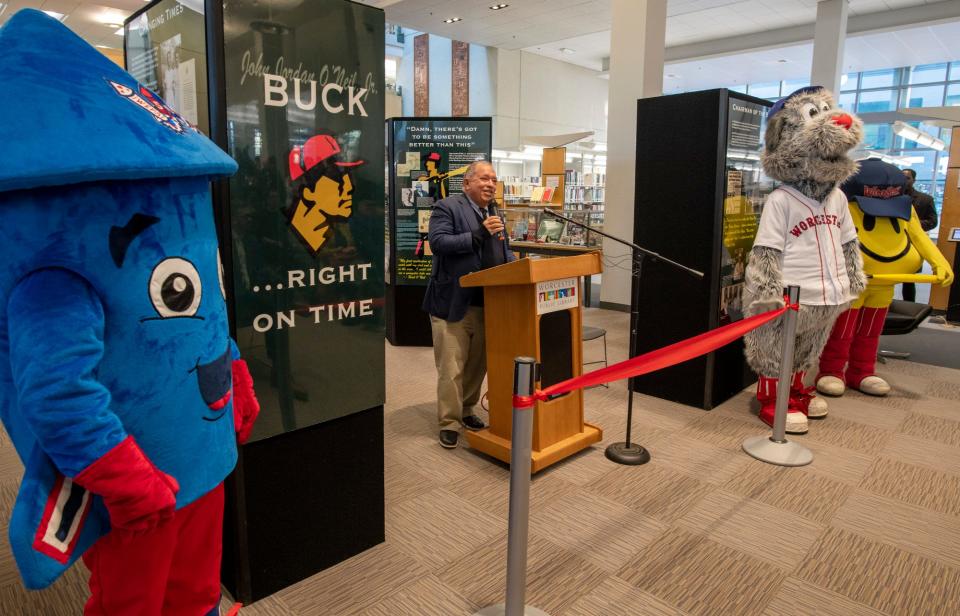 Dr. Charles Steinberg, president of the Worcester Red Sox, speaks during the opening of an exhibit on loan from the Negro Leagues Baseball Museum at the Worcester Public Library Wednesday. The display highlights the life of baseball player, scout and coach Buck O’Neil.