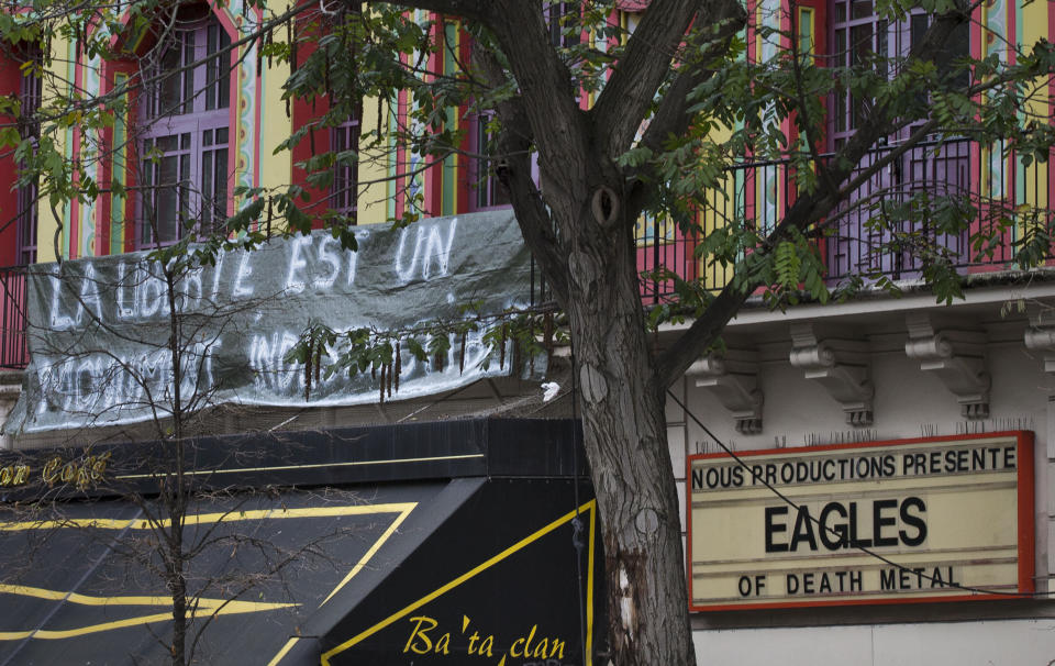 FILE - In this Nov. 17, 2015 file photo, a banner reading "Freedom is a monument which can not be destroyed" on the facade of the Bataclan concert hall in Paris. For more than two weeks, dozens of survivors from the Bataclan concert hall in Paris have testified in a specially designed courtroom about the Islamic State’s attacks on Nov. 13, 2015 – the deadliest in modern France. The testimony marks the first time many survivors are describing – and learning – what exactly happened that night at the Bataclan, filling in the pieces of a puzzle that is taking shape as they speak. (AP Photo/Peter Dejong, File)