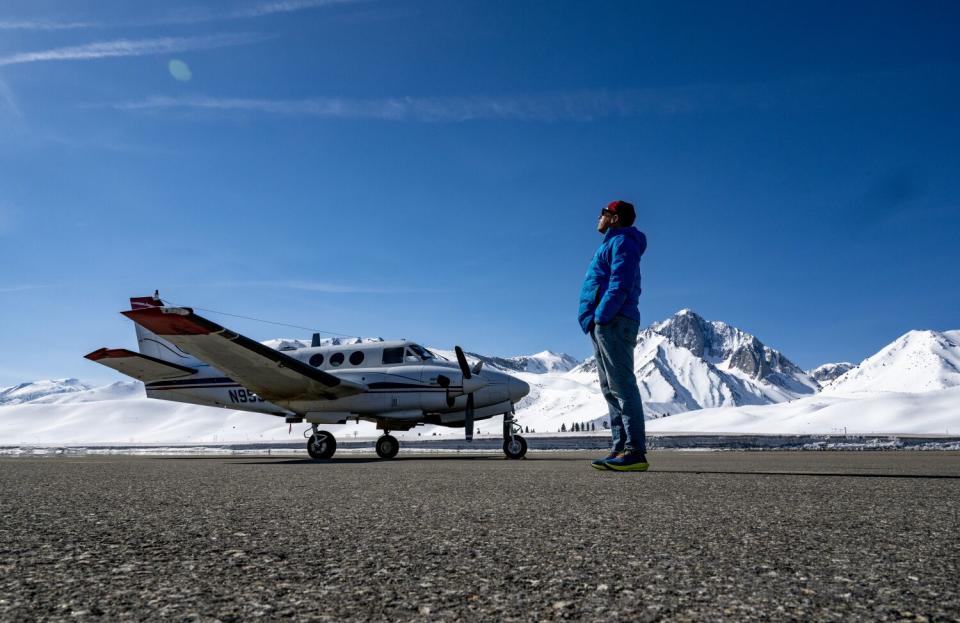 Thomas Painter stands on the tarmac at Mammoth-Yosemite Airport.