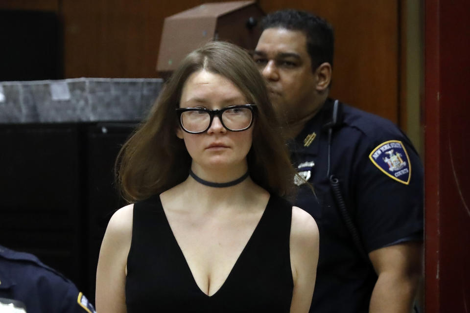 Anna Sorokin arrives in New York State Supreme Court on March 27, 2019, wearing her signature choker and V-neck dress. (Photo: ASSOCIATED PRESS)