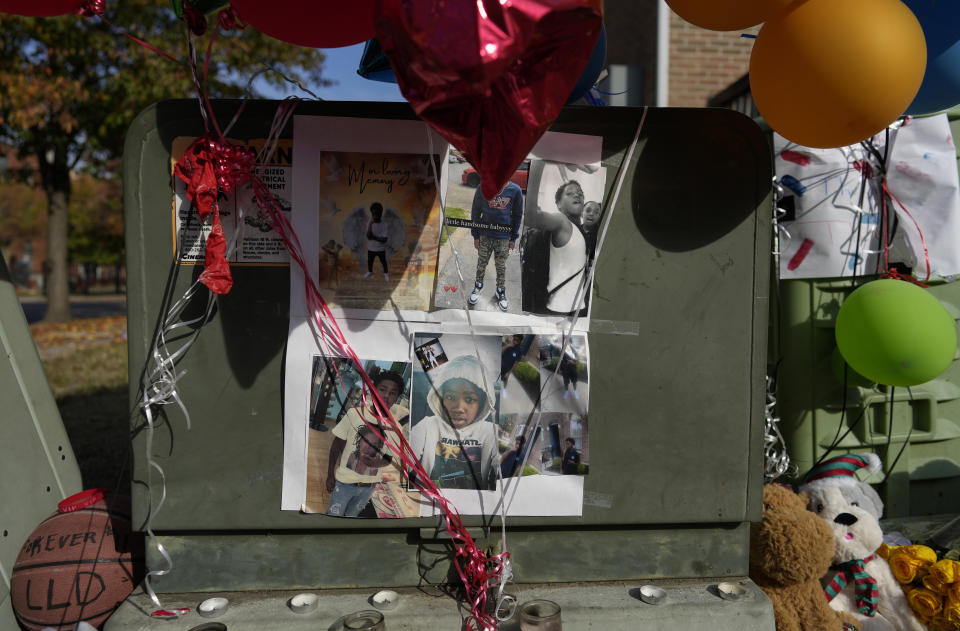 Images of Dominic Davis, an 11-year-old boy who was killed in a weekend shooting, are part of a makeshift memorial, Monday, Nov 6, 2023, in Cincinnati. Police Chief Terri Theetge told reporters Sunday that a shooter in a sedan fired 22 rounds "in quick succession" into a crowd of children just before 9:30 p.m. Friday on the city's West End. (AP Photo/Carolyn Kaster)