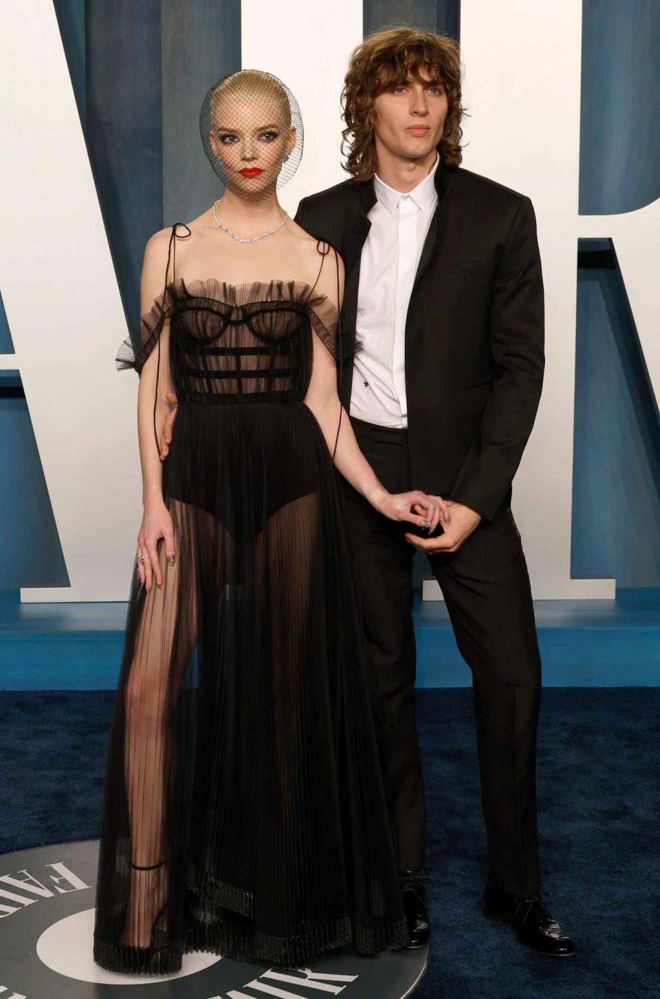 Anya Taylor-Joy and Malcolm McRae attend the 2022 Vanity Fair Oscar Party hosted by Radhika Jones at Wallis Annenberg Center for the Performing Arts on March 27, 2022 in Beverly Hills, California