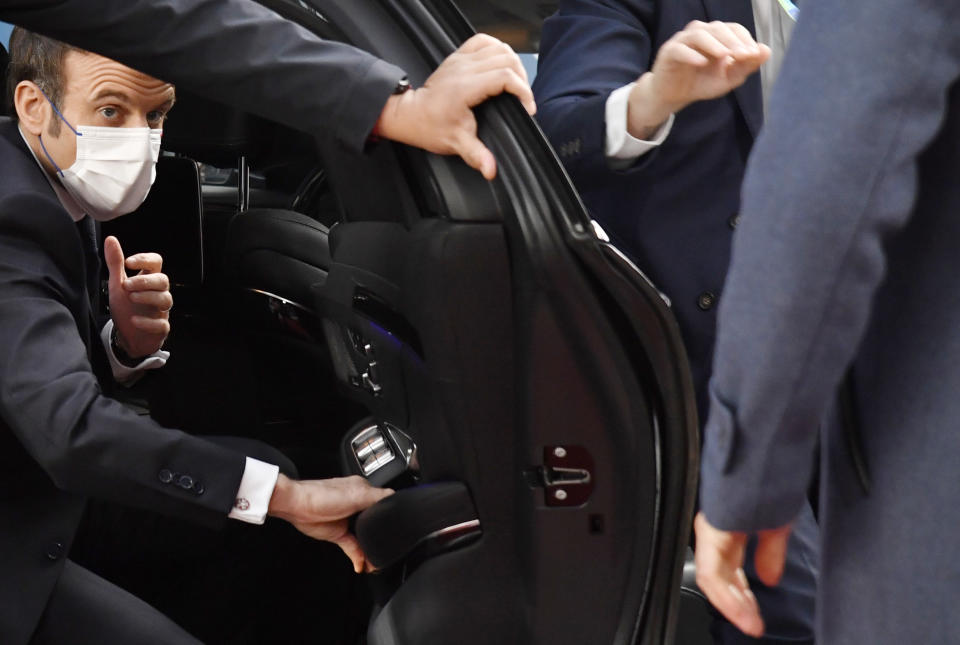 French President Emmanuel Macron arrives for an extraordinary meeting of EU leaders to discuss Ukraine at the European Council building in Brussels, Thursday, Feb. 17, 2022. EU leaders are meeting in Brussels for an extraordinary meeting on the Ukraine and Russia situation, ahead of a meeting with African Union leaders. (AP Photo/Geert Vanden Wijngaert, Pool)