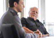 Four-time Indianapolis 500 auto race winner and NTT Indy Car series car owner A.J. Foyt listens while winner of this year's Indy 500, Helio Castroneves, speaks during a gathering with other four-time winners Al Unser (1970, 1971, 1978, 1987) and Rick Mears (1979, 1984, 1988, 1991) at the Indianapolis Motor Speedway in Indianapolis, Tuesday, July 20, 2021. Castroneves previously won the race in 2001, 2002, 2009. (AP Photo/Doug McSchooler)