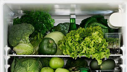 fridge full of green vegetables and fruits