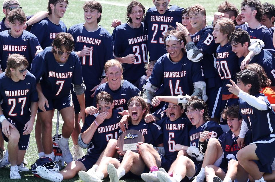 Briarcliff players celebrate their 14-2 victory over Schuylerville in the boys lacrosse Class D regional final at Shaker High School in Albany June 4, 2022.  