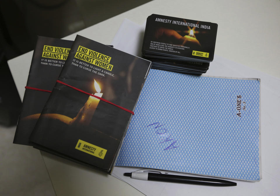 Publicity materials lie on a table at the Amnesty International India headquarters in Bangalore, India, Tuesday, Feb. 5, 2019. International rights groups and foreign aid organizations with deep roots in India say they are struggling to operate under the administration of Prime Minister Narendra Modi, whose Hindu nationalist Bharatiya Janata Party has elevated the role of homegrown social groups while cracking down on foreign charities. (AP Photo/Aijaz Rahi)