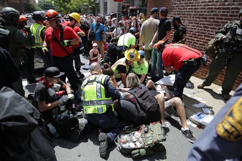 <div class="inline-image__caption"><p>Rescue workers and medics tend to people who were injured when a car plowed through a crowd of anti-fascist counter-demonstrators marching through the downtown shopping district Aug. 12, 2017, in Charlottesville, Virginia.</p></div> <div class="inline-image__credit">Chip Somodevilla/Getty</div>