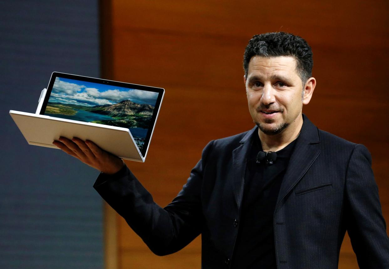 Panos Panay, Corporate Vice President for Surface Computing holds the new Microsoft Surface Book i7 laptop. REUTERS/Lucas Jackson