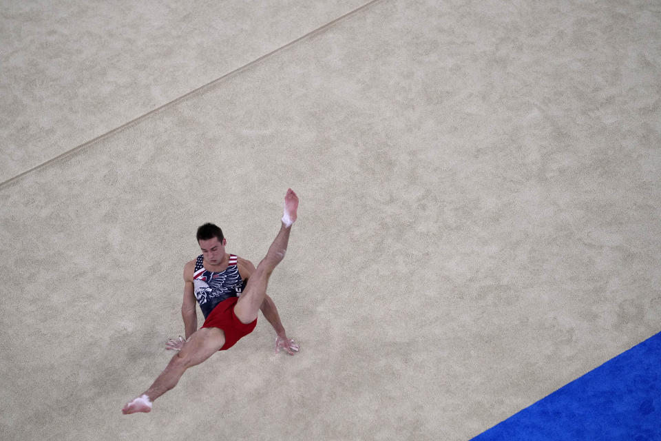 Samuel Mikulak, of the United States, performs on the floor exercise during men's artistic gymnastics team final at the 2020 Summer Olympics, Monday, July 26, 2021, in Tokyo, Japan. (AP Photo/Jeff Roberson)