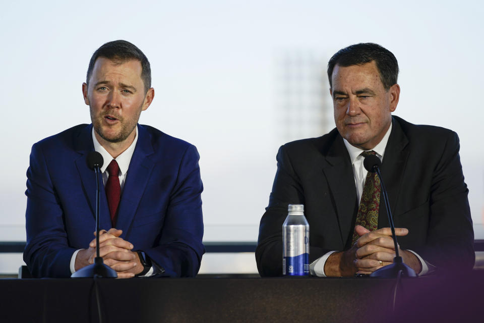 Lincoln Riley, left, the new head football coach of the University of Southern California, and Athletic Director Mike Bohn, answer questions during a ceremony in Los Angeles, Monday, Nov. 29, 2021. (AP Photo/Ashley Landis)