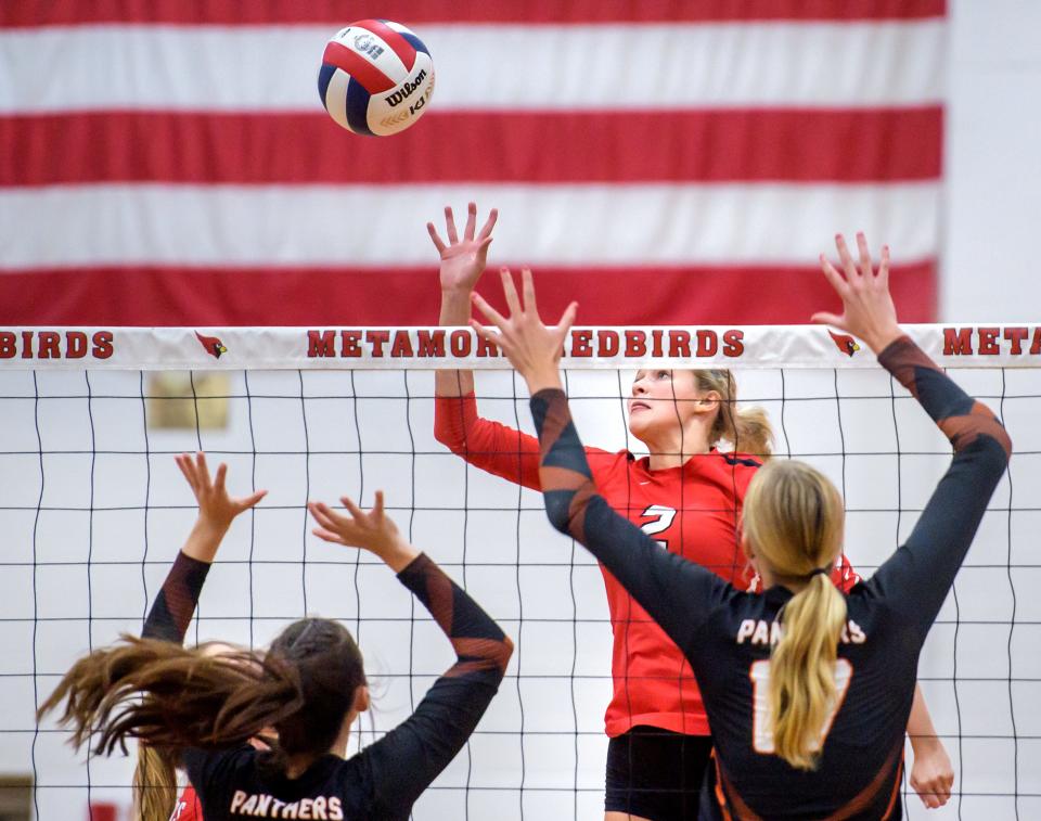 Metamora's Bella Gregory knocks the ball over the Washington defense in the first set of their volleyball match Tuesday, Sept. 5, 2023 in Metamora. The Redbirds downed the Panthers in straight sets.