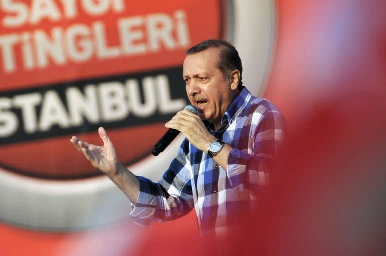 Turkish Prime Minister Recep Tayyip Erdogan makes a speech to his supporters during a rally on June 16, 2013 in Istanbul. Opponents accuse Erdogan of authoritarian tendencies and of forcing Islamic conservative reforms on the mainly Muslim but staunchly secular nation of 76 million