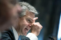 FBI Director Christopher Wray testifies before a Senate Homeland Security and Governmental Affairs Committee hearing to discuss security threats 20 years after the 9/11 terrorist attacks, Tuesday, Sept. 21, 2021 on Capitol Hill in Washington. (Greg Nash/Pool via AP)