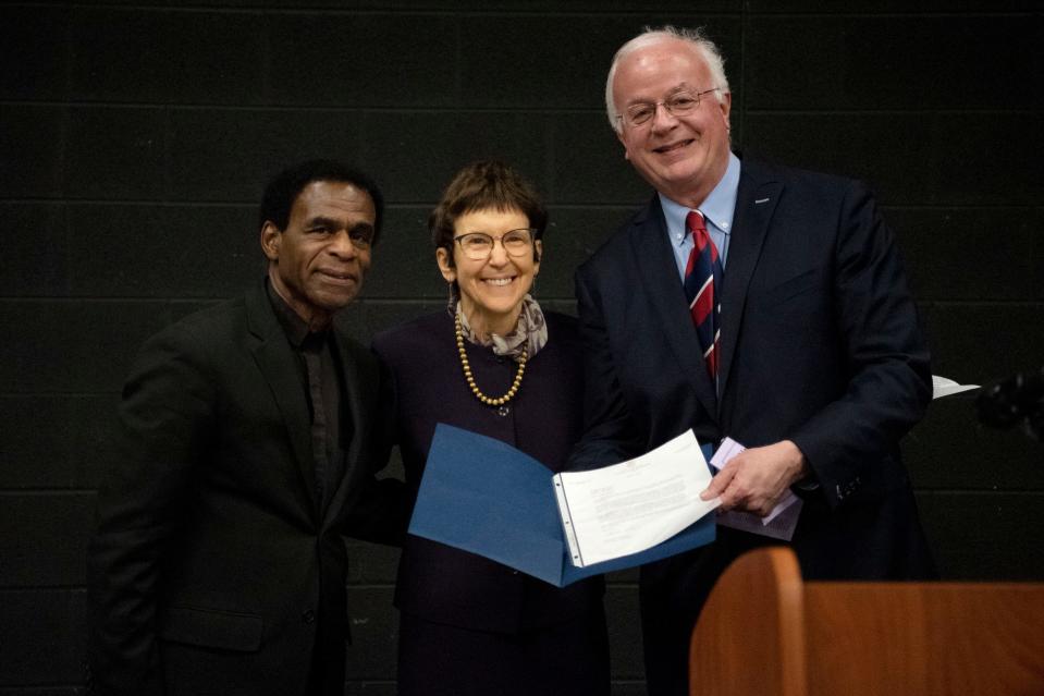 Bobby Holley, Margaret Lincoln, Ph.D., and Mayor Mark Behnke smile for a picture with a proclamation to honor Holley at Lakeview High School in Battle Creek on Wednesday, April 6, 2022.