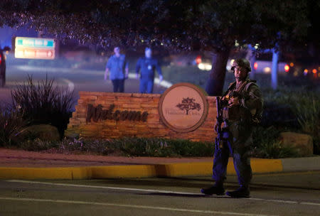 Police guard the site of a mass shooting at a bar in Thousand Oaks, California, U.S. November 8, 2018. REUTERS/Ringo Chiu