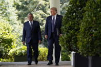 President Donald Trump and Mexican President Andres Manuel Lopez Obrador arrive for an event in the Rose Garden at the White House, Wednesday, July 8, 2020, in Washington. (AP Photo/Evan Vucci)