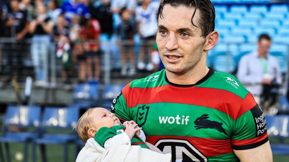 Cameron Murray holds his baby Avalon.