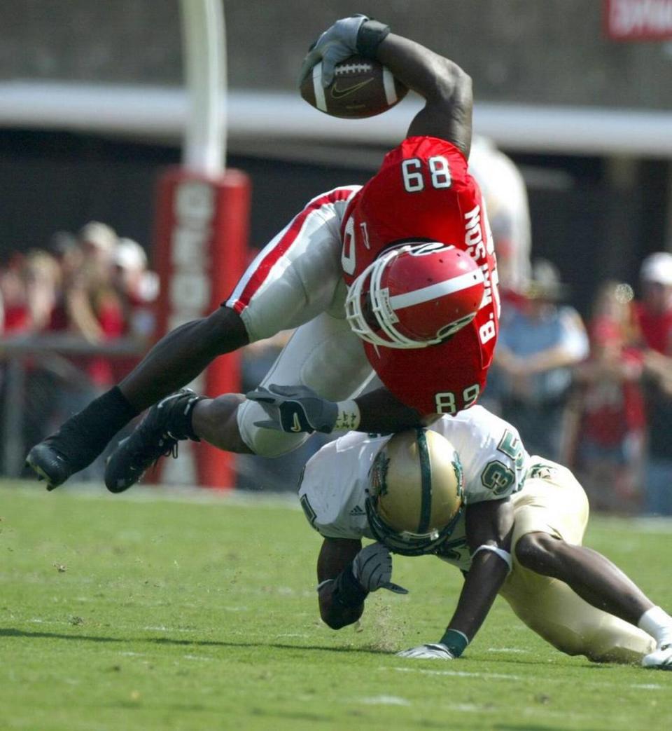 -- NO MAGS, NO SALES -- KRT SPORTS STORY SLUGGED: UAB-GEORGIA KRT PHOTOGRAPH BY BRANT SANDERLIN/ATLANTA JOURNAL-CONSTITUTION (October 25) ATHENS, GA-- UGA’s Benjamin Watson is upended after making a catch in front of UAB’s Warren Butler during the first half as No. 4 Georgia beat UAB 16-13, Saturday, October 25, 2003 in Athens, Georgia. (lde) 2003