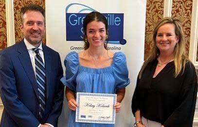 Kelsey Kolarik receives a scholarship from the Greenville chapter of the Society for Human Resource Management.