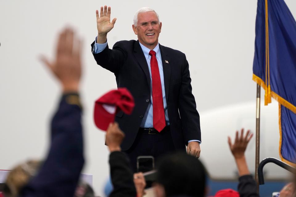 Vice President Mike Pence waves to supporters during a campaign rally, Wednesday, Oct. 21, 2020, in, Portsmouth, N.H.