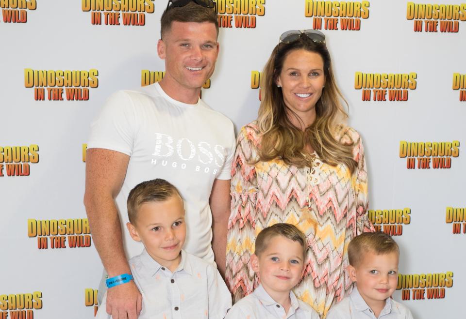 Danielle Lloyd and husband Michael O'Neill with her eldest sons sons Archie, Harry and George. (PA)