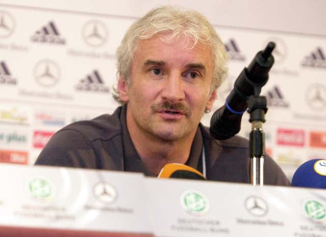 Rudi Voller talks with the media