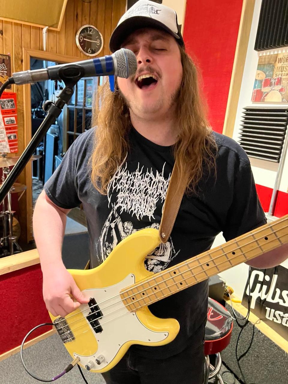 Russell Jones plays bass for Beach City Postal Service, a Stark County rock band that will be performing on March 16 in a Neil Young tribute concert at The Auricle in downtown Canton.