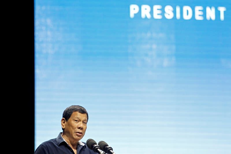 FILE PHOTO: Philippines President Rodrigo Duterte addresses the resident Filipino community at a convention hall in Singapore