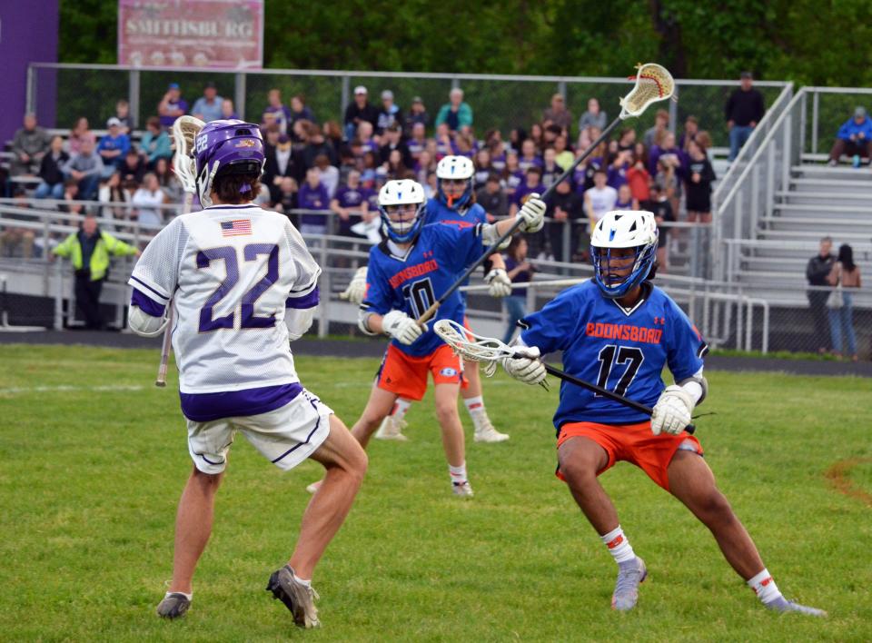 Jesse Garcia Trujillo (17) and the Boonsboro Warriors defend against Smithsburg's Ryan Linn (22).