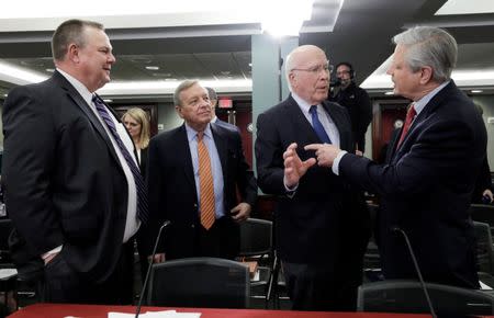 U.S. Senator Jon Tester (D-MT), Senator Dick Durbin (D-IL), Senator Patrick Leahy (D-VT) and Senator John Hoeven (R-ND) talk as a bipartisan group of U.S. lawmakers gathers to hold a first public negotiating session over the U.S. federal government shutdown and border security on Capitol Hill in Washington, U.S. January 30, 2019. REUTERS/Yuri Gripas