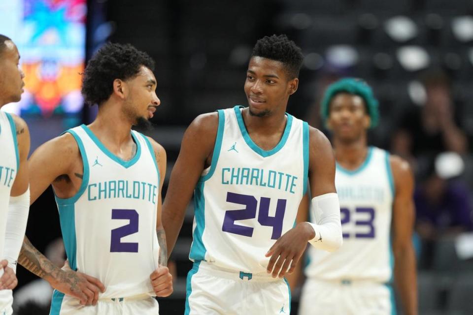 Charlotte Hornets guard James Bouknight (2) and forward Brandon Miller (24) talk during the first quarter against the Golden State Warriors at Golden 1 Center on Wednesday, July 5, 2023.