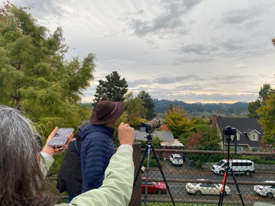 “I doubt we’ll see anything but the sunrise was beautiful,” said Laxman Murugesh, a Bay Area resident who traveled to Oregon to witness the eclipse. He arrived at the College Hill Reservoir around 7 a.m. Saturday to set up for the event.