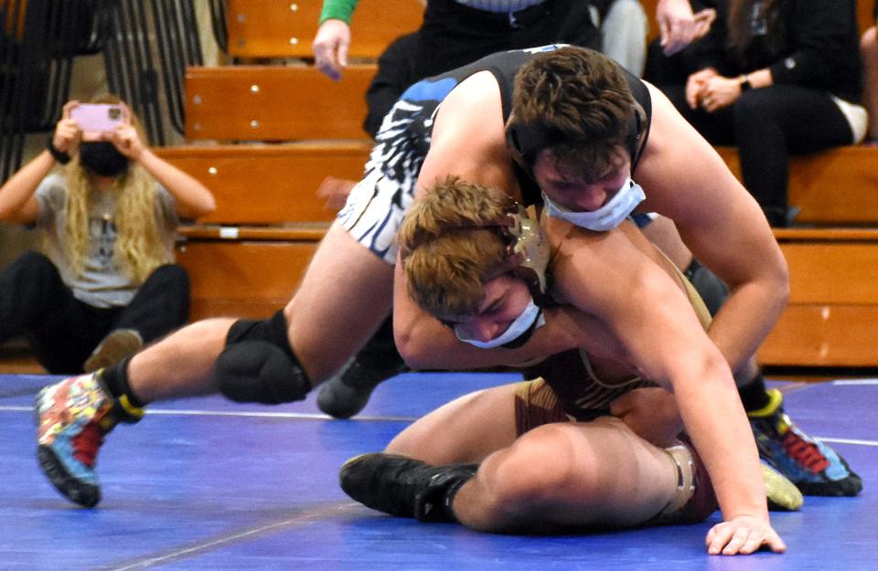 Dolgeville Blue Devil Jared Bilinski has the upper hand on Canastota Raider Casey Bixby during a Dec. 21, 2021, match in Dolgeville. Wrestling at different weights Saturday, Bilinski and Bixby both won individual titles at Section III's Class D tournament.