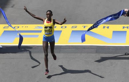 Atsede Baysa of Ethiopia crosses the finish line to win the womenv¢Ç¨Ñ¢s division of the 120th running of the Boston Marathon in Boston, Massachusetts April 18, 2016. REUTERS/Gretchen Ertl Picture Supplied by Action Images