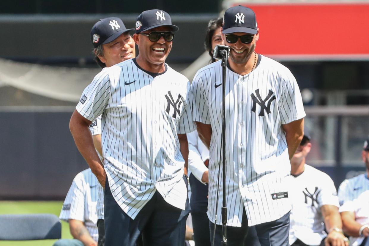 Aug 24, 2024; Bronx, New York, USA; Former New York Yankees relief pitcher Mariano Rivera (l) and shortstop Derek Jeter (r) speak during the Old TimersÕ Day Ceremony at Yankee Stadium. Mandatory Credit: Wendell Cruz-USA TODAY Sports