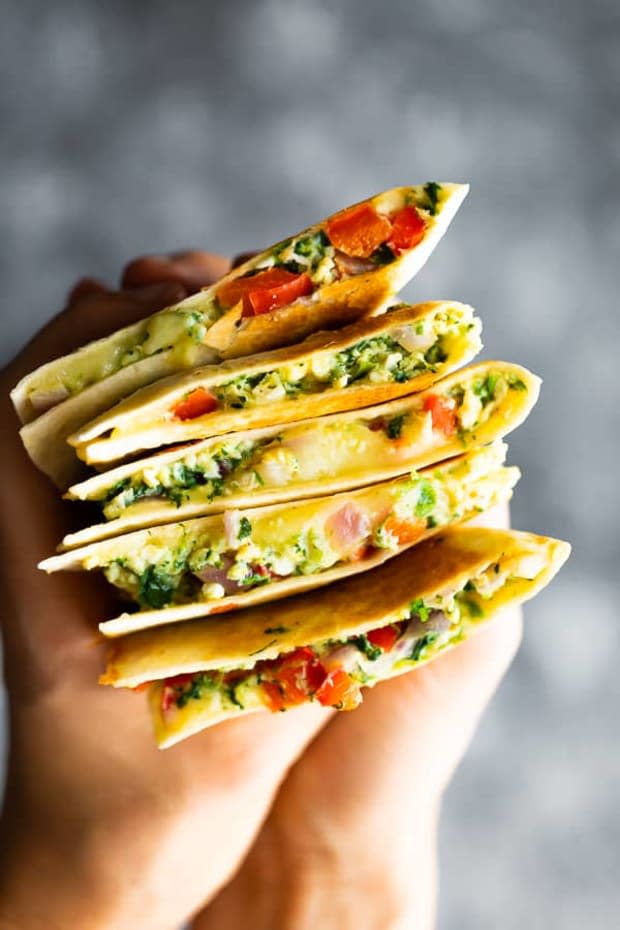 <p>Make-ahead breakfast quesadillas filled with scrambled eggs, feta cheese, spinach and red peppers. An easy, healthy week day breakfast that’s perfect for meal prep!</p><p><strong>Get the recipe: <a href="https://sweetpeasandsaffron.com/spinach-feta-red-pepper-breakfast-quesadillas-make-ahead/" rel="nofollow noopener" target="_blank" data-ylk="slk:Spinach Feta Red Pepper Breakfast Quesadillas;elm:context_link;itc:0;sec:content-canvas" class="link "><em>Spinach Feta Red Pepper Breakfast Quesadillas</em></a></strong></p><p>Sweet Peas and Saffron</p>
