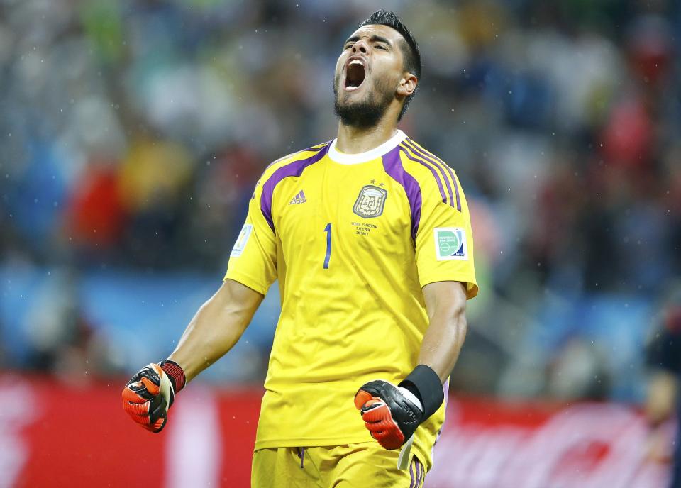 Argentina's goalkeeper Romero reacts after saving a goal attempt from Vlaar of the Netherlands during a penalty shoot-out during their 2014 World Cup semi-finals at the Corinthians arena in Sao Paulo