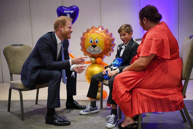 <p>Yui Mok/PA Images via Getty</p> Prince Harry meeting George Hall and mum Hollie Pearson at the WellChild Awards in Sept. 2023