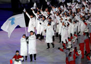 <p>An all-white look. A clean look. A unified look on an opening ceremony that stressed, above all, peace and unity. </p>