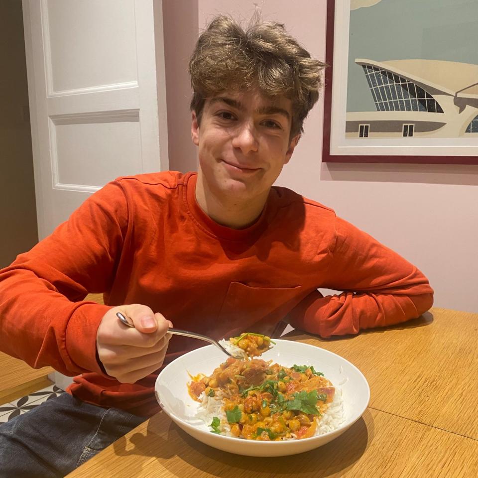 Miranda's son, Jacob, enjoys her chickpea and coconut milk curry