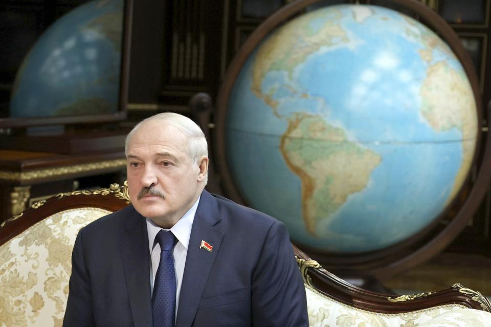 FILE - Belarusian President Alexander Lukashenko listens to World Health organization Director for Europe Hans Kluge during their meeting in Minsk, Belarus on Thursday, Oct. 14, 2021. For most of his 27 years as the authoritarian president of Belarus, Alexander Lukashenko has disdained democratic norms, making his country a pariah in the West and bringing him the sobriquet of “Europe’s last dictator." Now, his belligerence is directly affecting Europe. (Maxim Guchek/BelTA Pool Photo via AP, File)