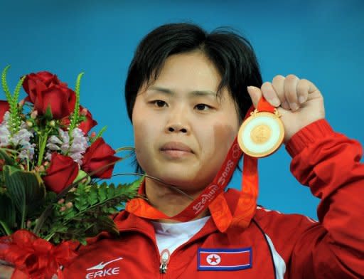 Pak Hyon-Suk of North Korea poses during the awarding ceremony for the women's 63kg weightlifting event at the 2008 Beijing Olympic Games. When Pak clinched the gold at the games, she heaped praise on Kim Jong-Il, who was known as the "Dear Leader" or "Dear General."